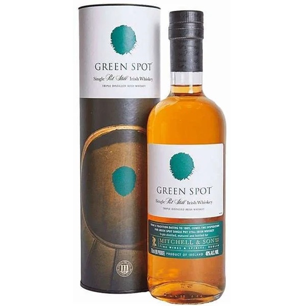 Green Spot Single Pot Still in a brown and white tube and a clear bottle with a green and white label.