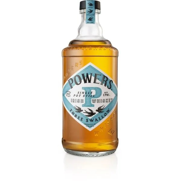Powers Three Swallows Single Pot Still with amber liquid in a clear bottle and a white and blue label.