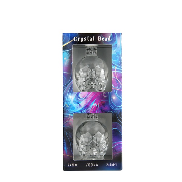 Crystal Head Vodka miniature skull heads in a purple and blue box.