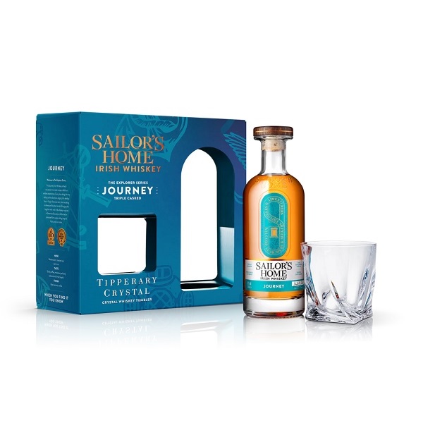 Sailor's Home Journey Irish Whiskey Gift Set in a blue box with a whiskey glass and a bottle of whiskey.