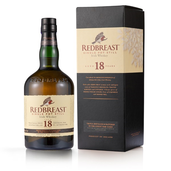 Redbreast 18 Year Old Single Pot Still Irish whiskey in a navy and cream box with a green glass bottle and a cream label.