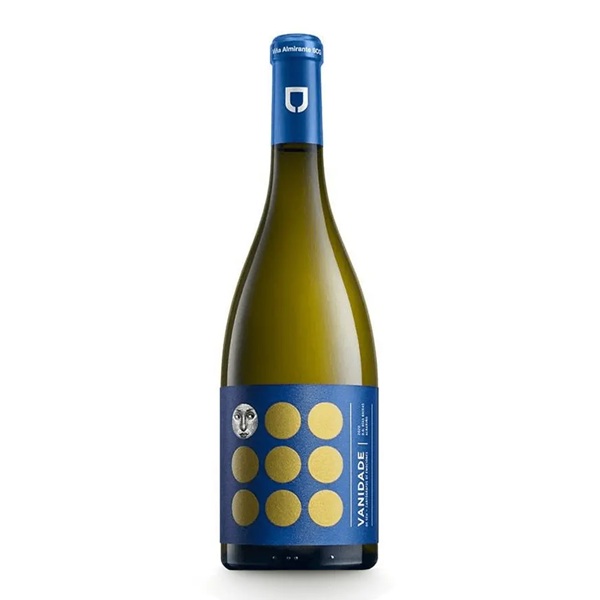 Vanidade Albariño in a dark green bottle with gold spots on a blue label.