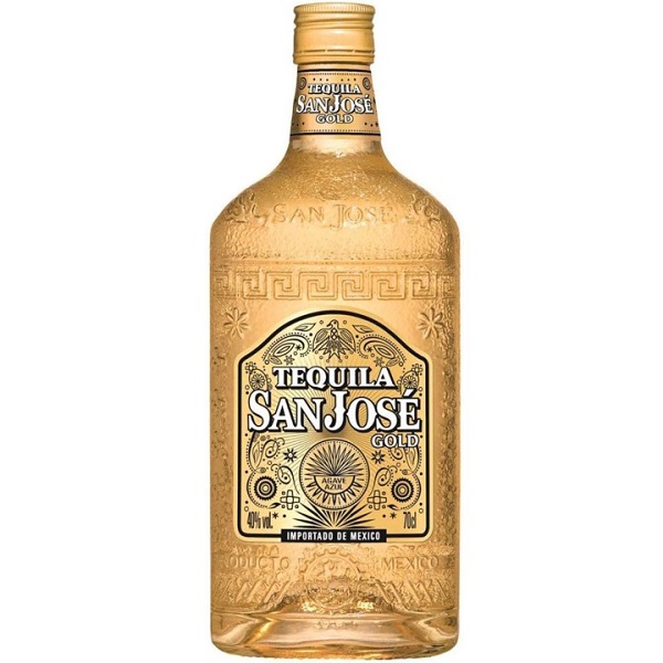 San Jose Tequila Gold in a bottle with patterns on the glass and a gold label.