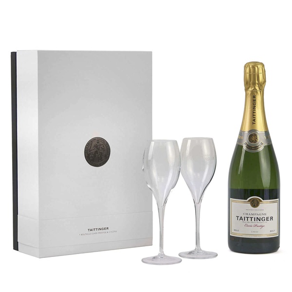 Taittinger Brut Reserve Champagne and Glasses Gift Box in a white box with a bottle of Champagne and two Champagne glasses.