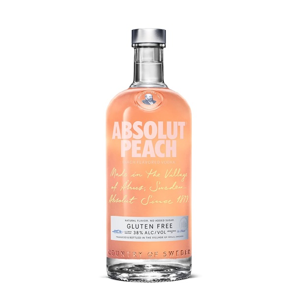 Absolut Peach Vodka in a clear bottle with a light peach colour background and white text.